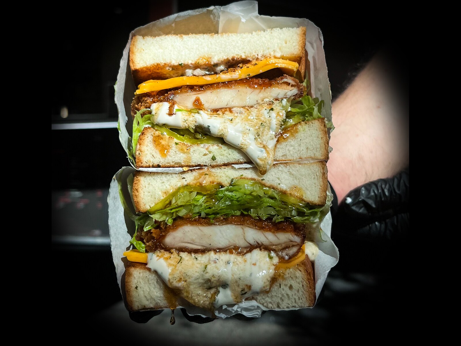 Chicken and Ranch sandwich: chicken schnitzel, ranch, hot honey, iceberg and pickles on milk bread
