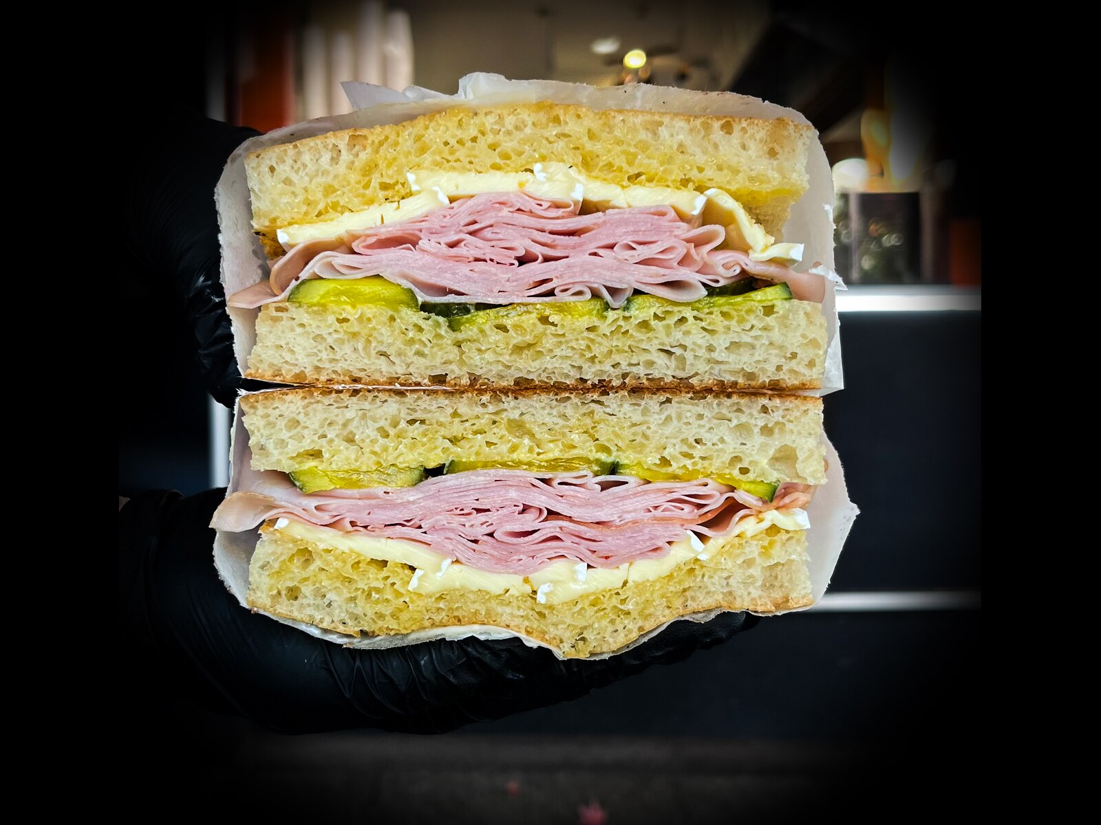 Ham and Brie sandwich: smoked ham, brie, salted butter and pickles on focaccia