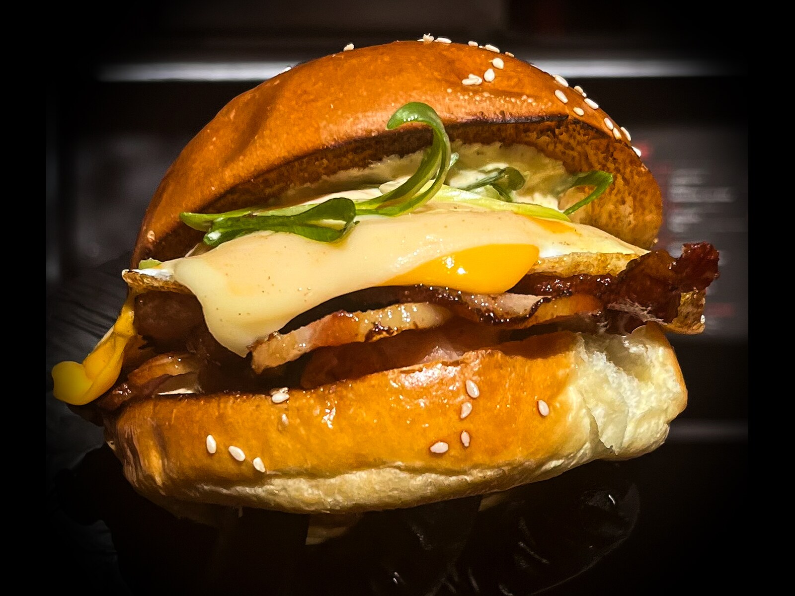 Big Buns Deli NY Bodega sandwich: bacon, soft fried egg and cheese on a sesame brioche bun