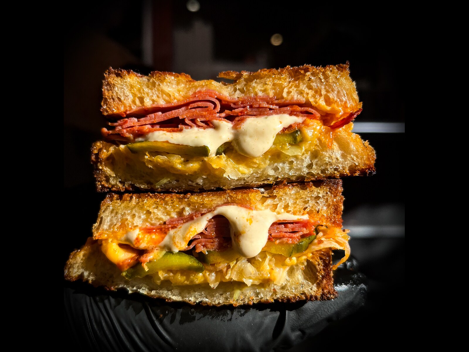 Reuben toastie: pastrami, sauerkraut, pickles and Deli sauce on buttered sourdough
